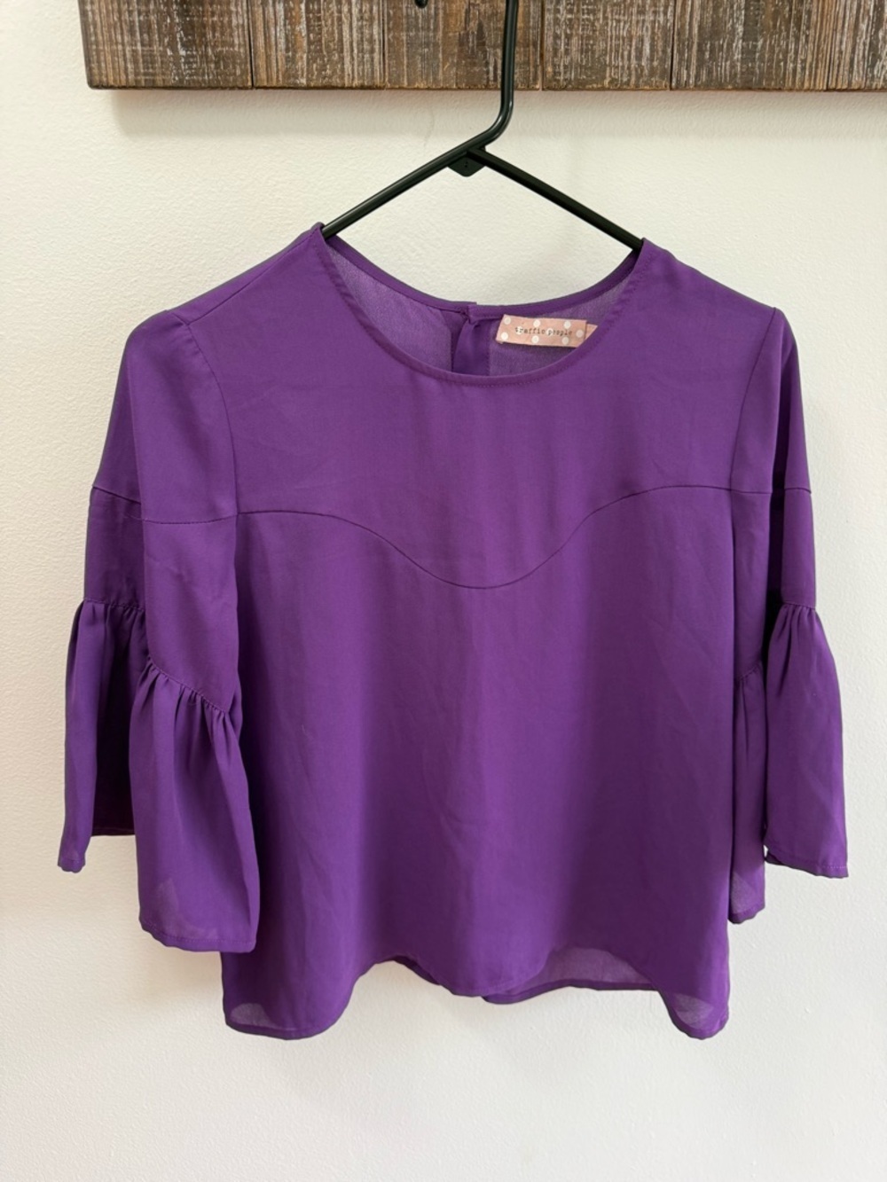 Traffic People purple top featuring bell sleeves and a button-up back
